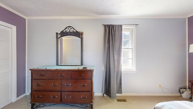 bedroom with baseboards, visible vents, a textured ceiling, and light colored carpet