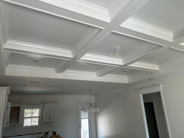 details featuring ornamental molding, beamed ceiling, and coffered ceiling