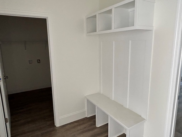 mudroom featuring dark wood-style floors and baseboards