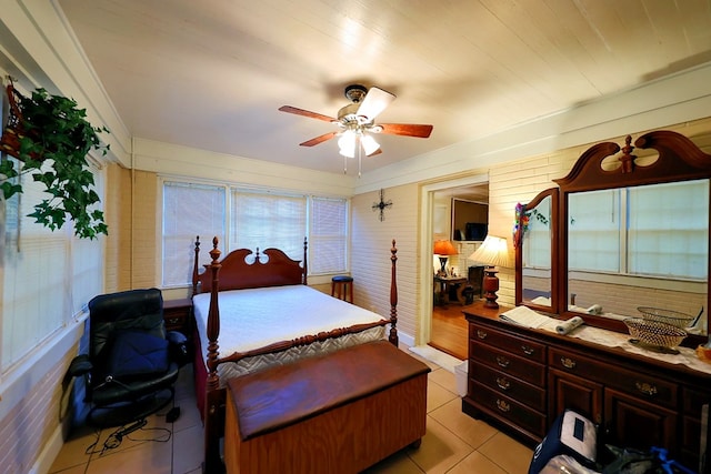 bedroom featuring light tile patterned floors and ceiling fan