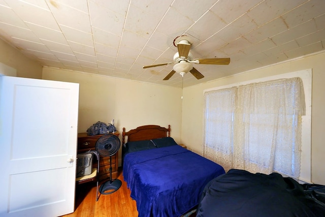 bedroom featuring a ceiling fan and light wood-type flooring