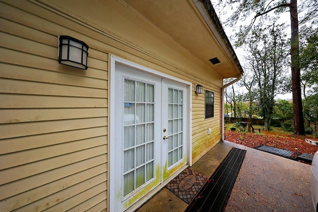 view of home's exterior with a patio and french doors