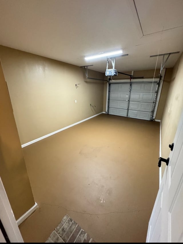 129 Eagles Landing Dr, Thomasville, GA 31792 - garage with a garage door opener and baseboards