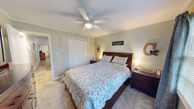 1216 Oriole Dr, Thomasville, GA 31792 - bedroom with crown molding, light carpet, ceiling fan, and a closet
