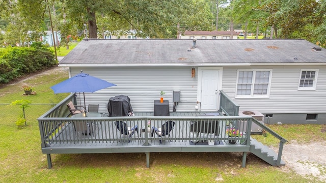 1216 Oriole Dr, Thomasville, GA 31792 - rear view of property with a wooden deck, a shingled roof, view of wooded area, and stairs