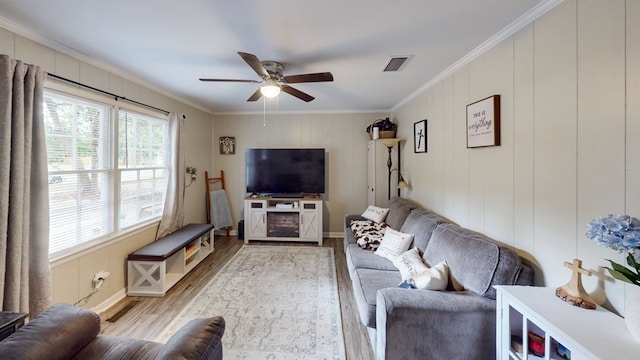 1216 Oriole Dr, Thomasville, GA 31792 - living room featuring wood finished floors, crown molding, and a ceiling fan