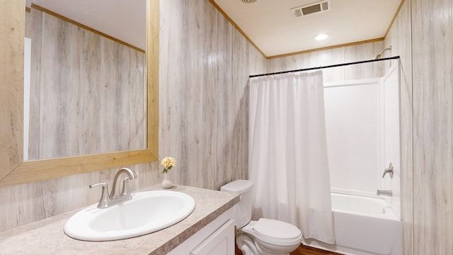 bathroom featuring vanity, shower / bath combination with curtain, toilet, and visible vents