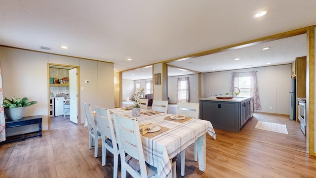 dining room with visible vents, recessed lighting, and light wood finished floors