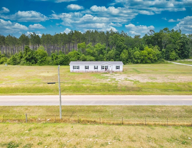 exterior space with a wooded view