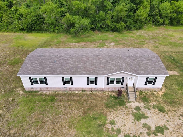 view of front of property featuring stairway, crawl space, and roof with shingles