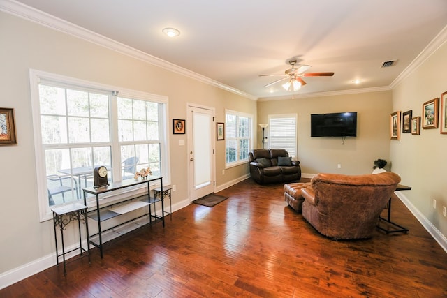 living room featuring ceiling fan, ornamental molding, and dark hardwood / wood-style floors