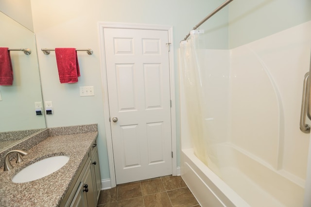 bathroom with shower / bath combo with shower curtain, tile patterned flooring, and vanity