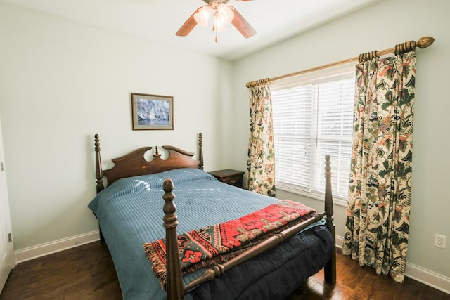 bedroom with ceiling fan and dark hardwood / wood-style flooring