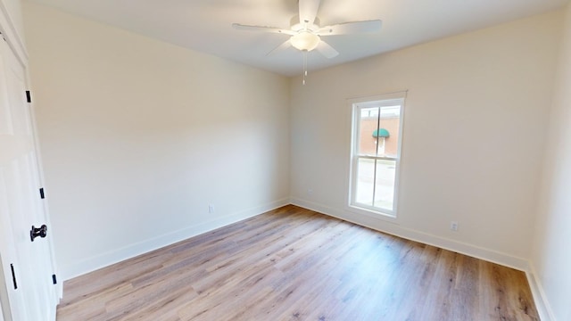 empty room featuring ceiling fan and light hardwood / wood-style flooring