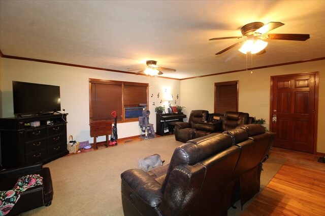 living room with crown molding and ceiling fan