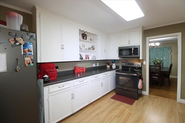 kitchen with white cabinetry, a notable chandelier, light hardwood / wood-style floors, stainless steel appliances, and crown molding