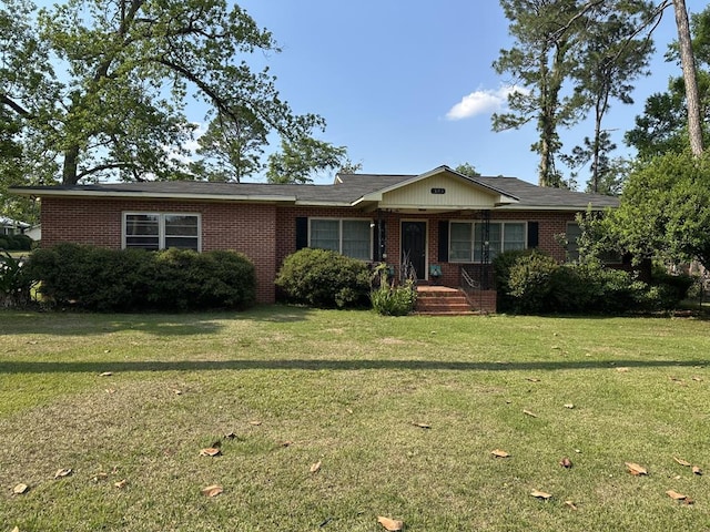 303 SE 4th Ave, Cairo, GA 39828 - ranch-style house with brick siding and a front lawn