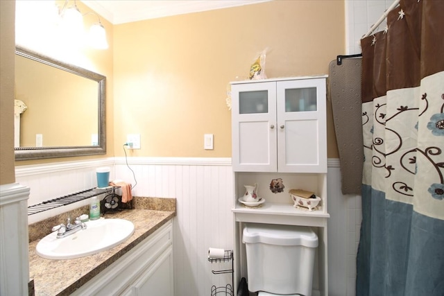 bathroom with vanity, toilet, and curtained shower