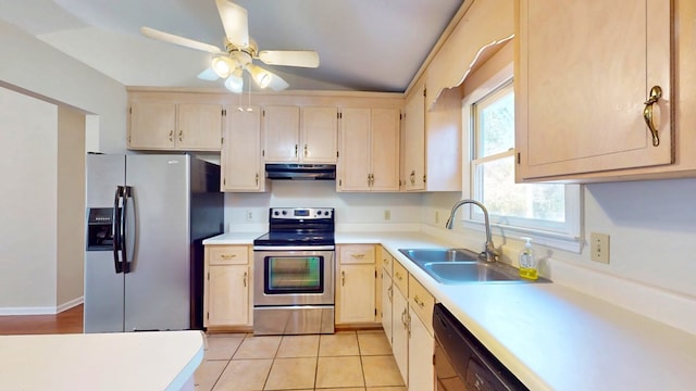 kitchen with light tile patterned flooring, a sink, stainless steel appliances, light countertops, and under cabinet range hood