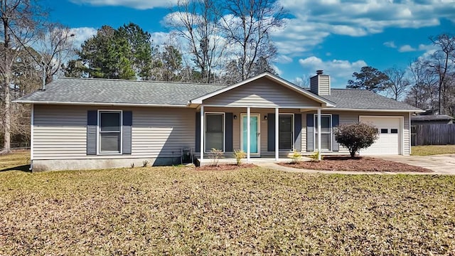 ranch-style house with covered porch, a front lawn, a chimney, and a garage