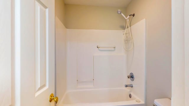 full bath featuring shower / washtub combination and toilet