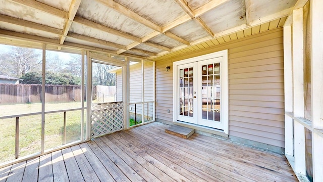 unfurnished sunroom featuring french doors and a healthy amount of sunlight