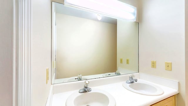 bathroom with double vanity and a sink