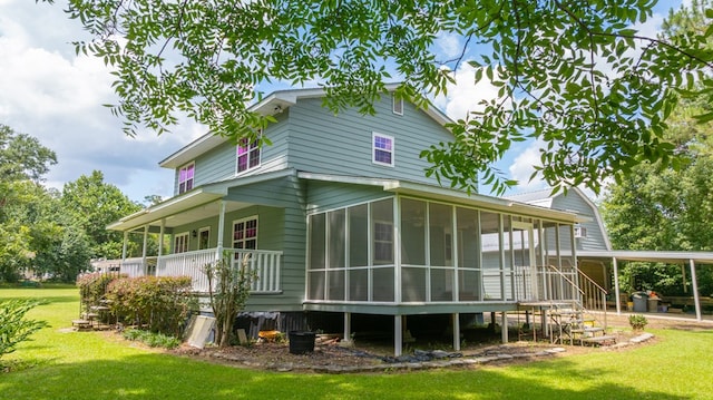 2001 Redfearn St, Barwick, GA 31720 - rear view of house featuring a lawn and a sunroom