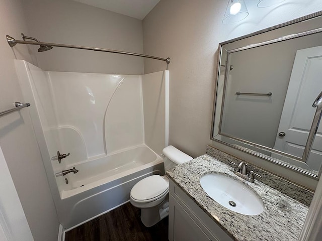 full bath with wood finished floors, toilet, vanity, and tub / shower combination
