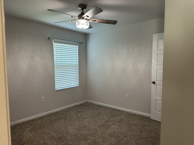 carpeted empty room featuring ceiling fan