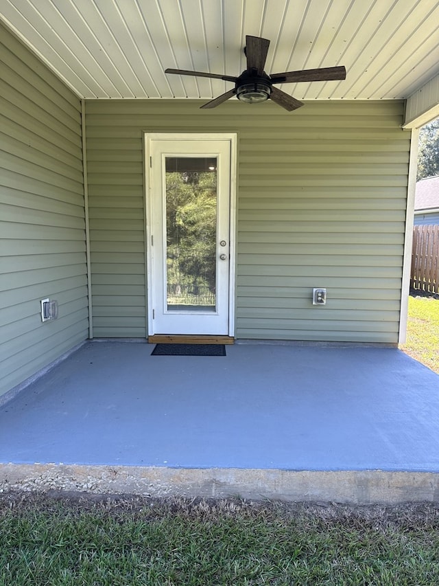 exterior space with ceiling fan