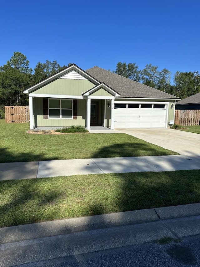 view of front facade featuring a garage and a front lawn