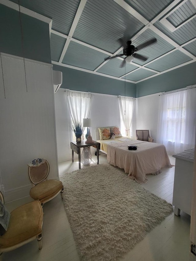 306 S Broad St, Bainbridge, GA 39819 - bedroom featuring wood finished floors, ceiling fan, and an AC wall unit