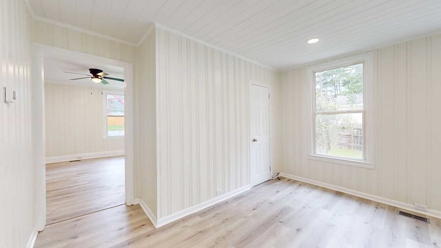 712 Young St, Thomasville, GA 31792 - unfurnished room featuring crown molding, wood finished floors, plenty of natural light, and ceiling fan