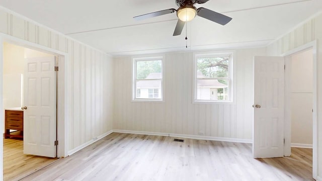 712 Young St, Thomasville, GA 31792 - empty room featuring light wood-style flooring and ceiling fan