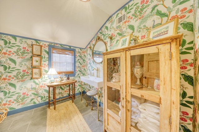 tiled bedroom with lofted ceiling