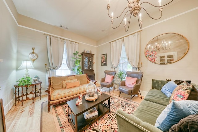 living room with wood-type flooring and an inviting chandelier