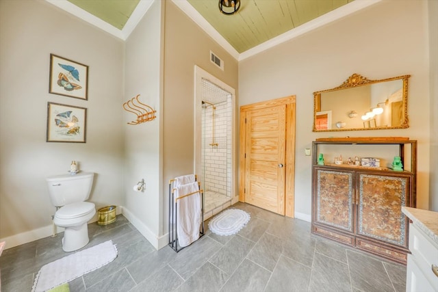 bathroom with crown molding, vanity, toilet, and a shower