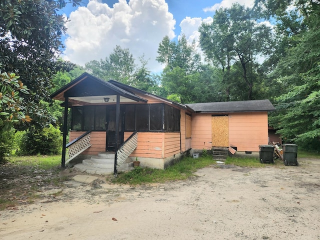 801 Magnolia St, Thomasville, GA 31792 - view of front of home featuring entry steps, a sunroom, and crawl space