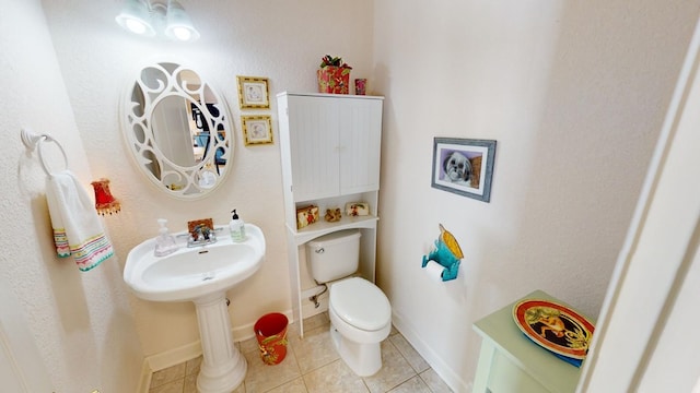 bathroom featuring tile patterned floors and toilet