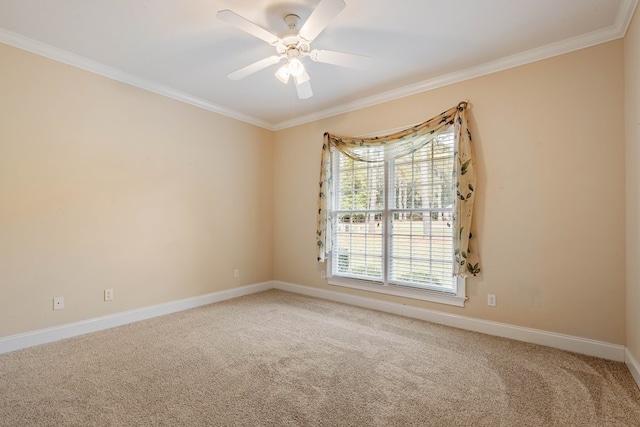 spare room featuring crown molding, carpet floors, and ceiling fan