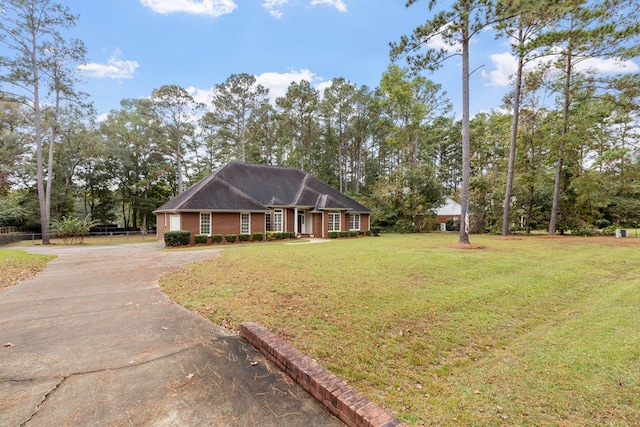 ranch-style house with a front yard