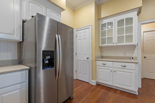 kitchen with crown molding, dark hardwood / wood-style floors, stainless steel fridge with ice dispenser, and white cabinets