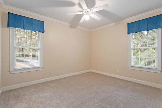 empty room with crown molding, light colored carpet, and a healthy amount of sunlight