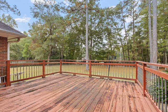 wooden terrace with a lawn