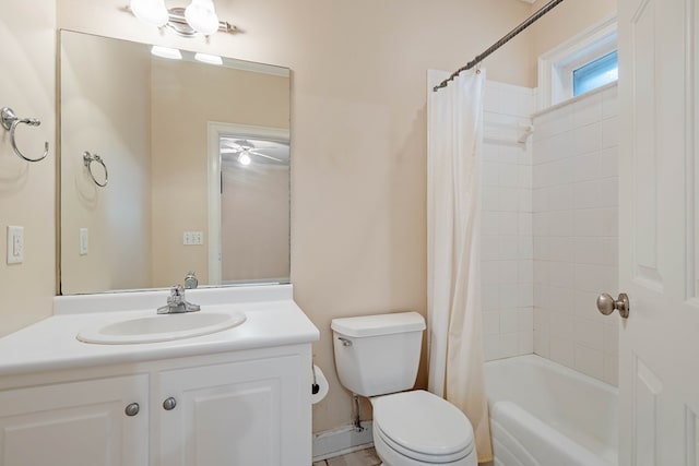 full bathroom with vanity, shower / bath combo, and toilet