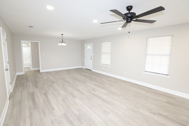 unfurnished room featuring ceiling fan and light hardwood / wood-style floors