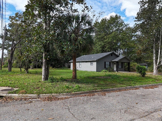 view of property exterior with a yard