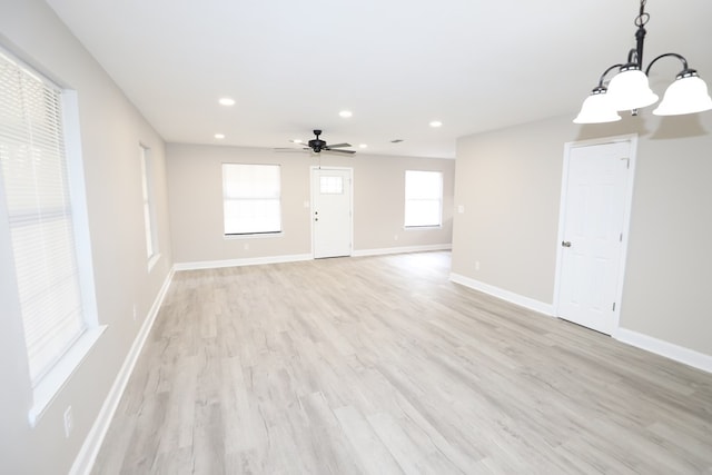 spare room with ceiling fan and light hardwood / wood-style floors