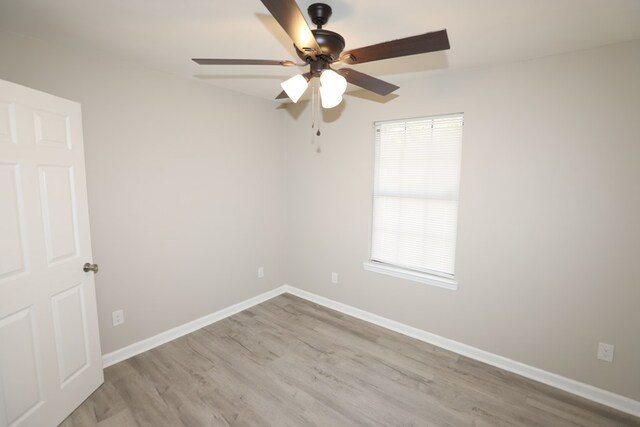 spare room featuring ceiling fan and light hardwood / wood-style floors